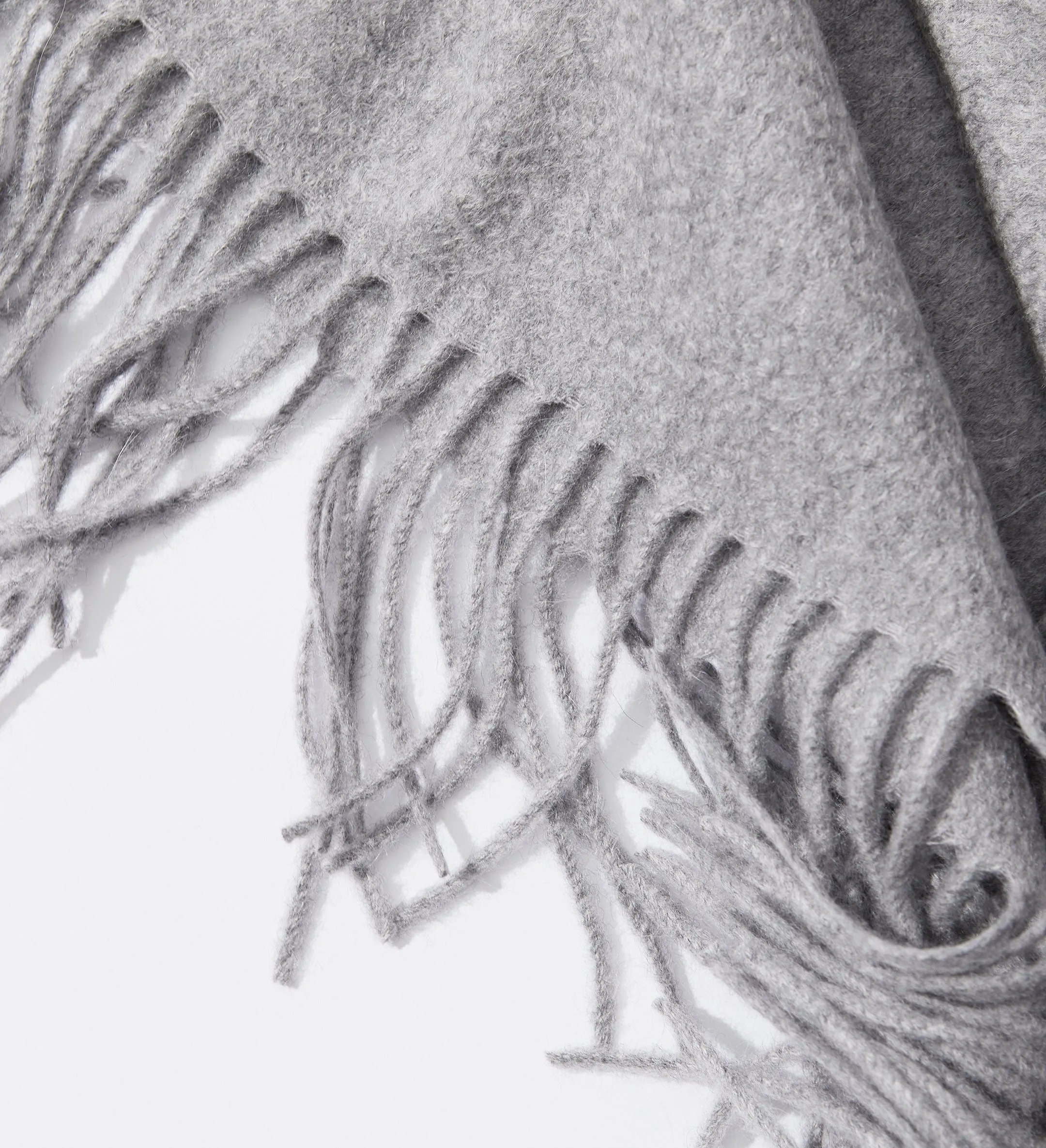 The Solid Cashmere Fringe Throw Blanket