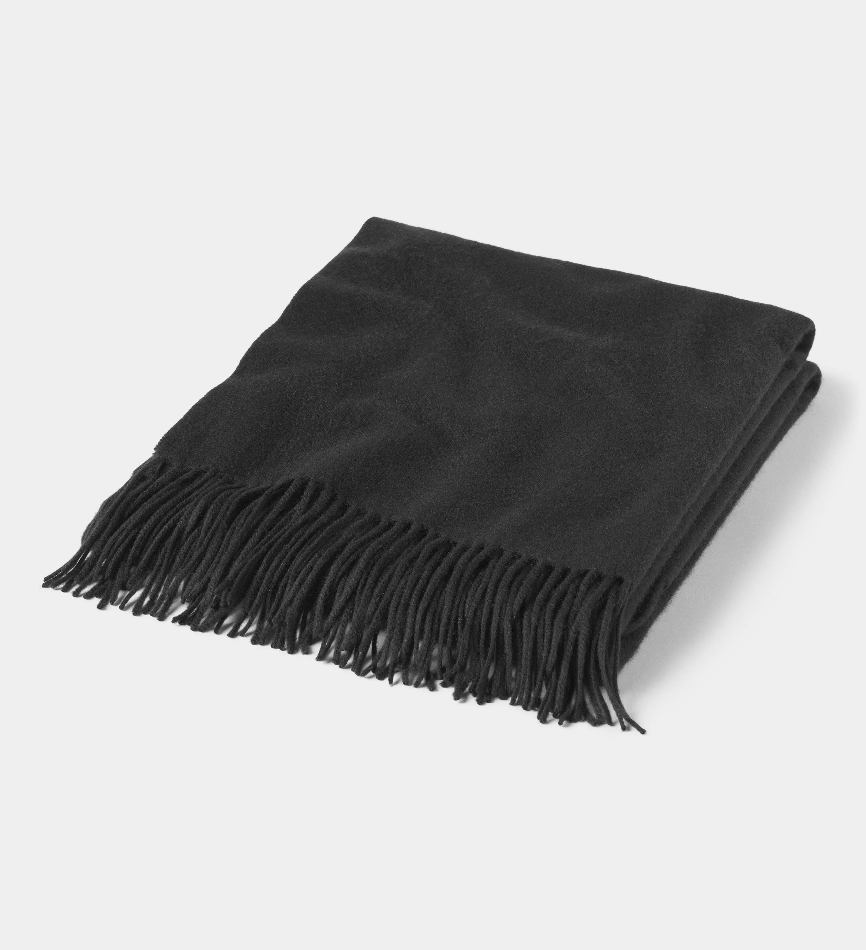 The Solid Cashmere Fringe Throw Blanket
