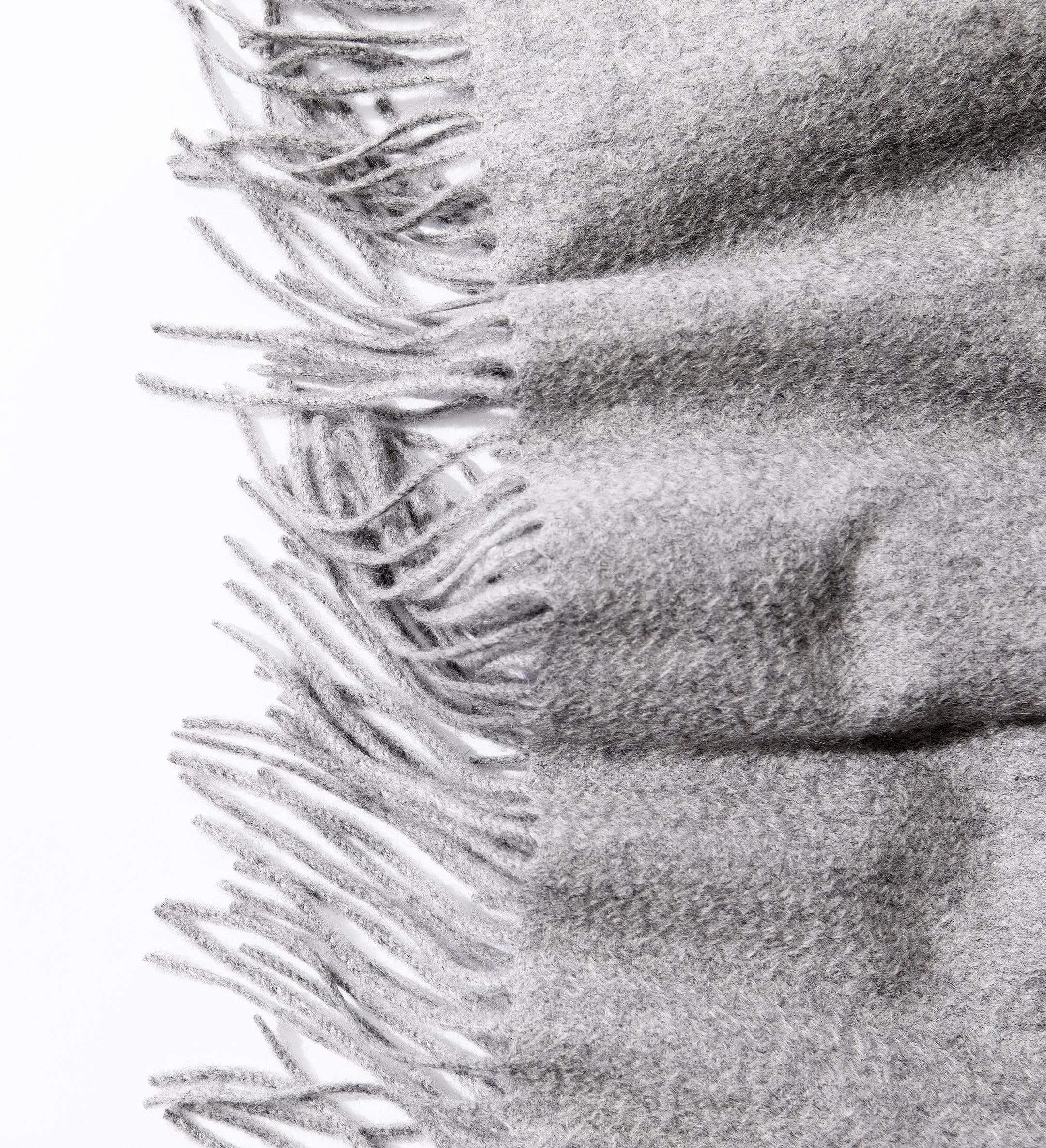 The Solid Cashmere Fringe Throw Blanket