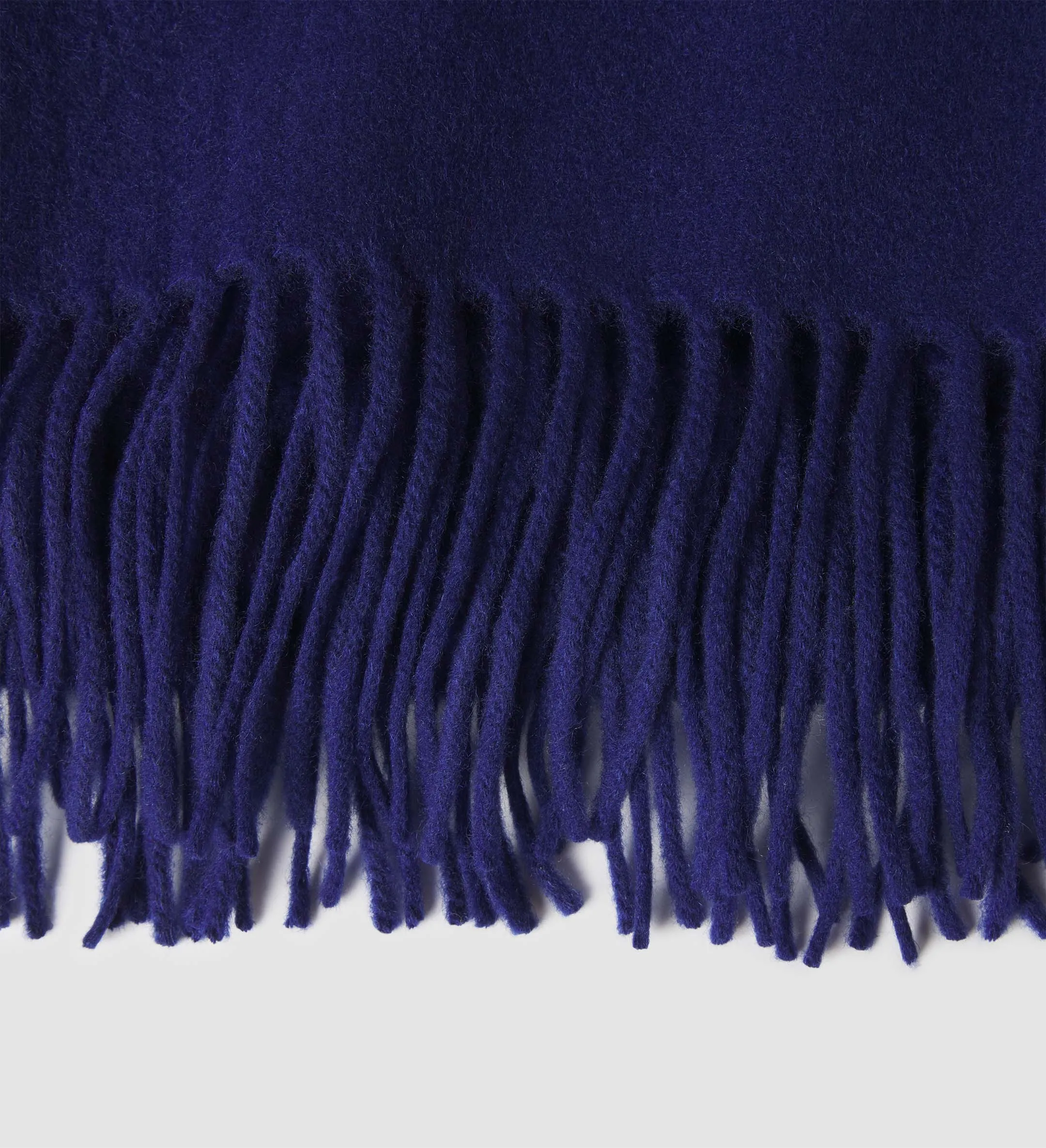 The Solid Cashmere Fringe Throw Blanket