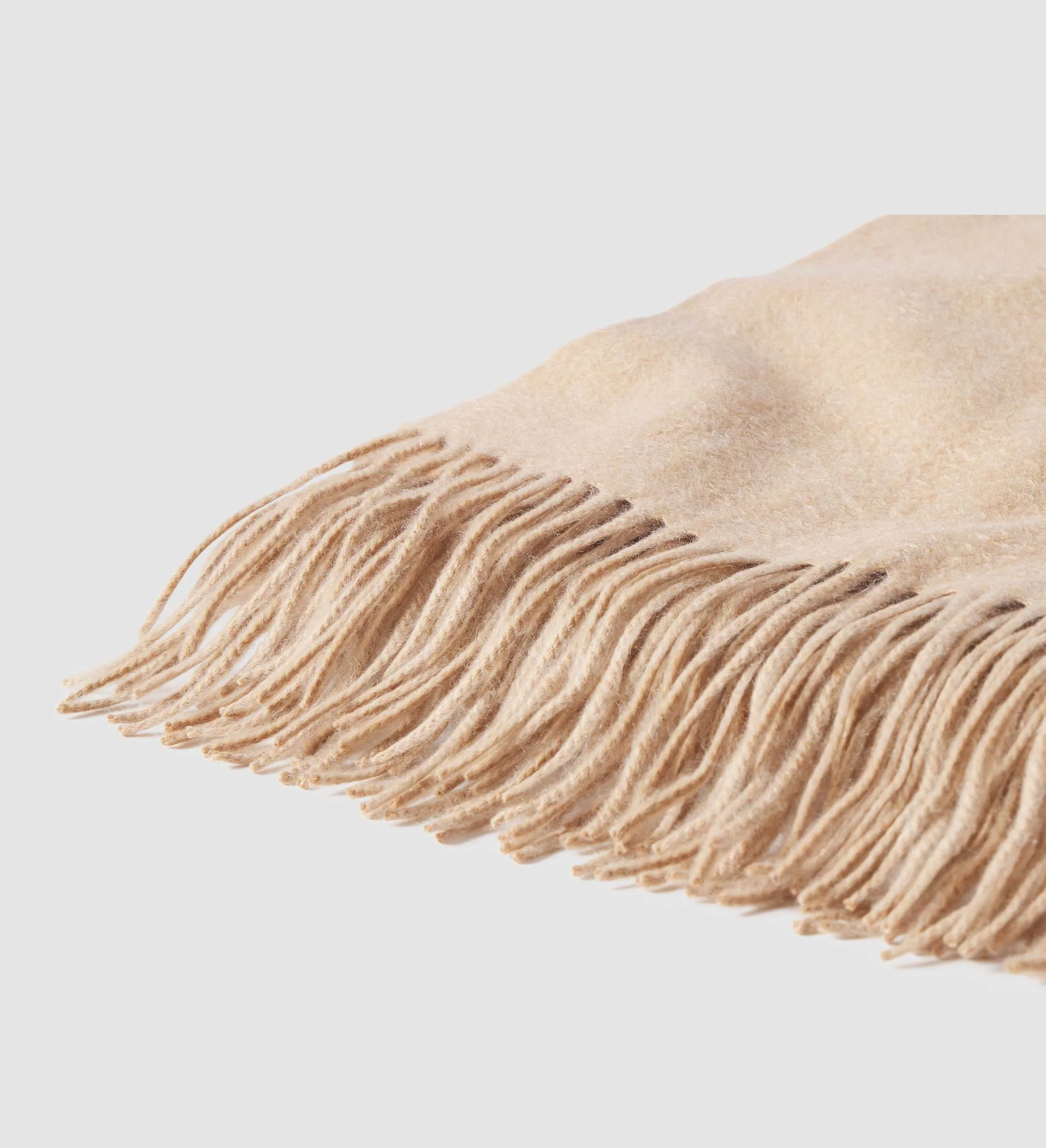 The Solid Cashmere Fringe Throw Blanket