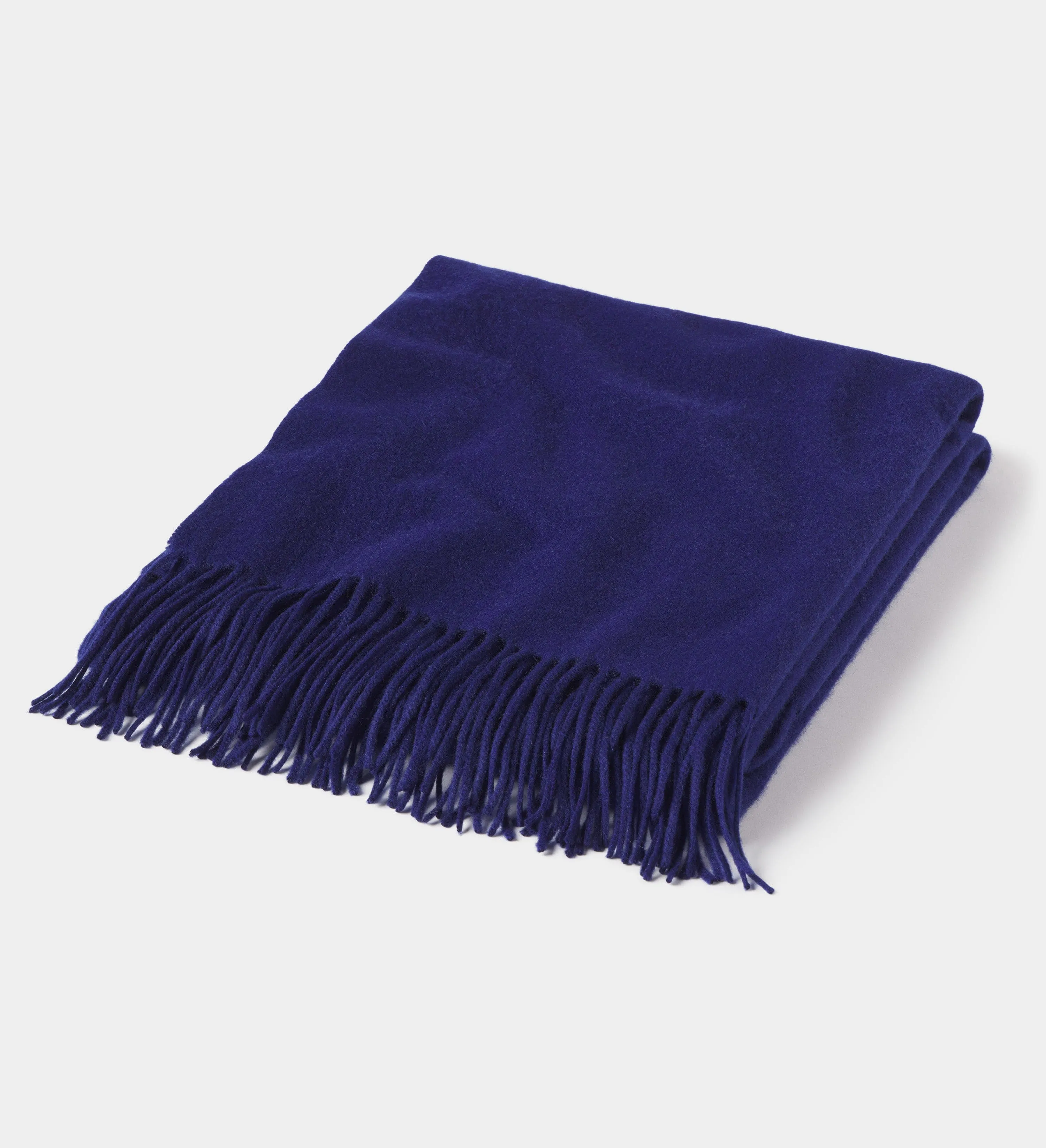 The Solid Cashmere Fringe Throw Blanket