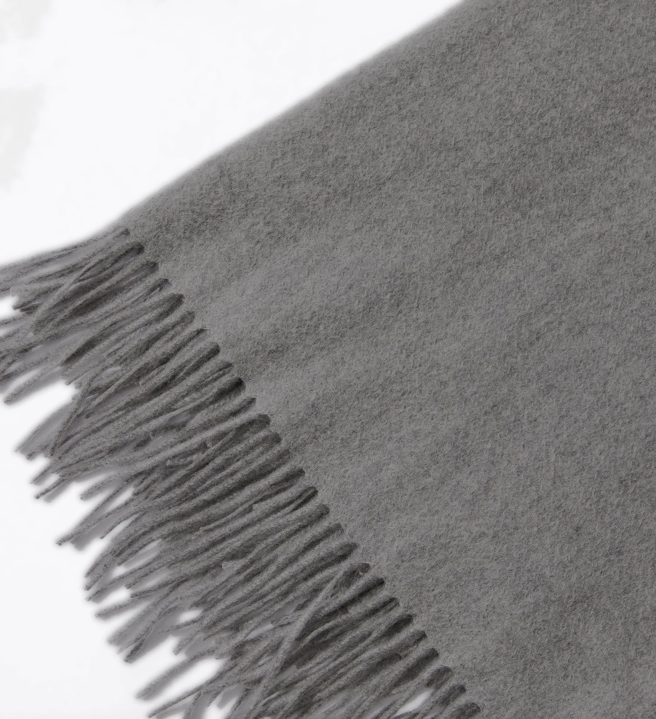 The Solid Cashmere Fringe Throw Blanket