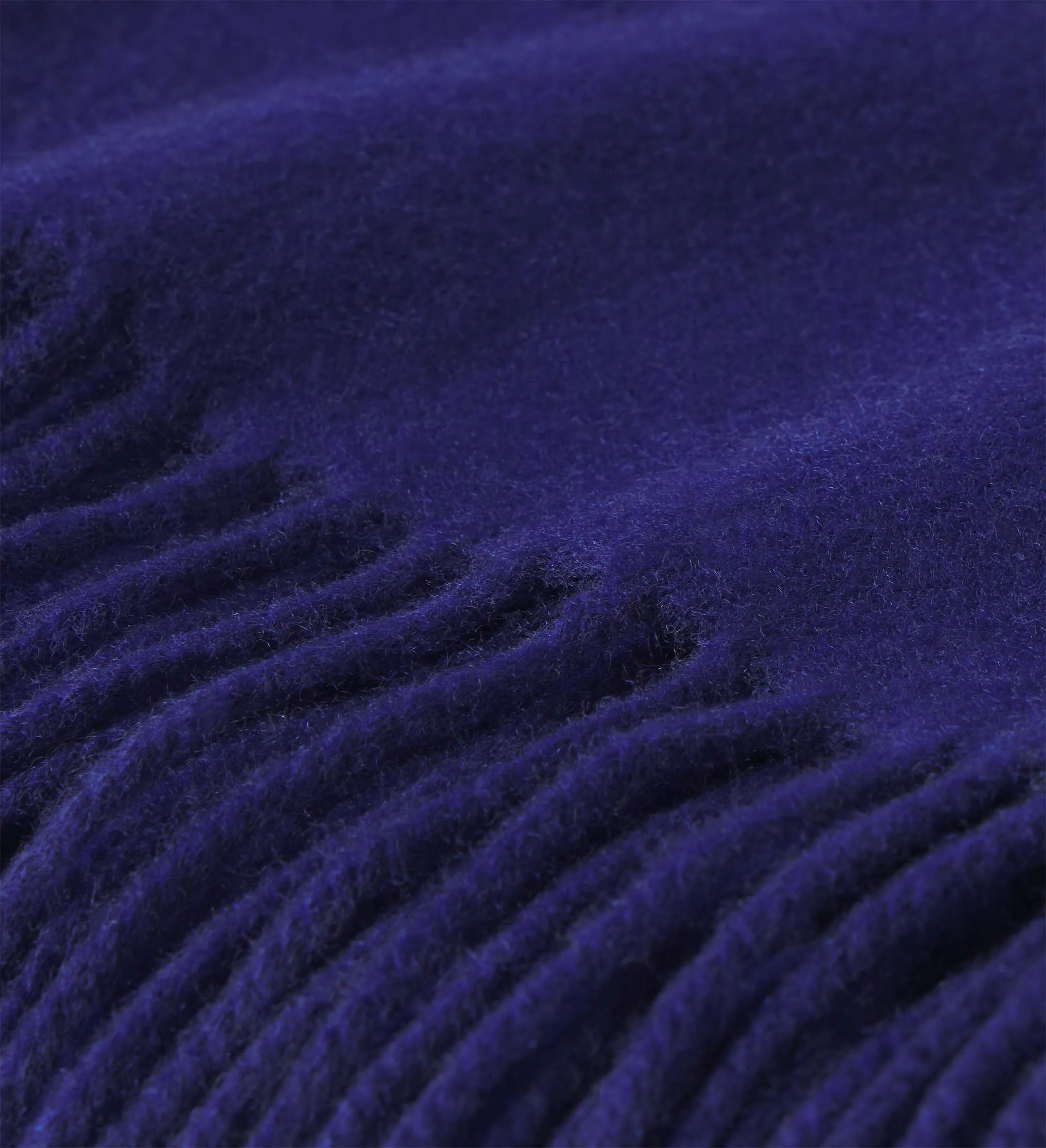 The Solid Cashmere Fringe Throw Blanket