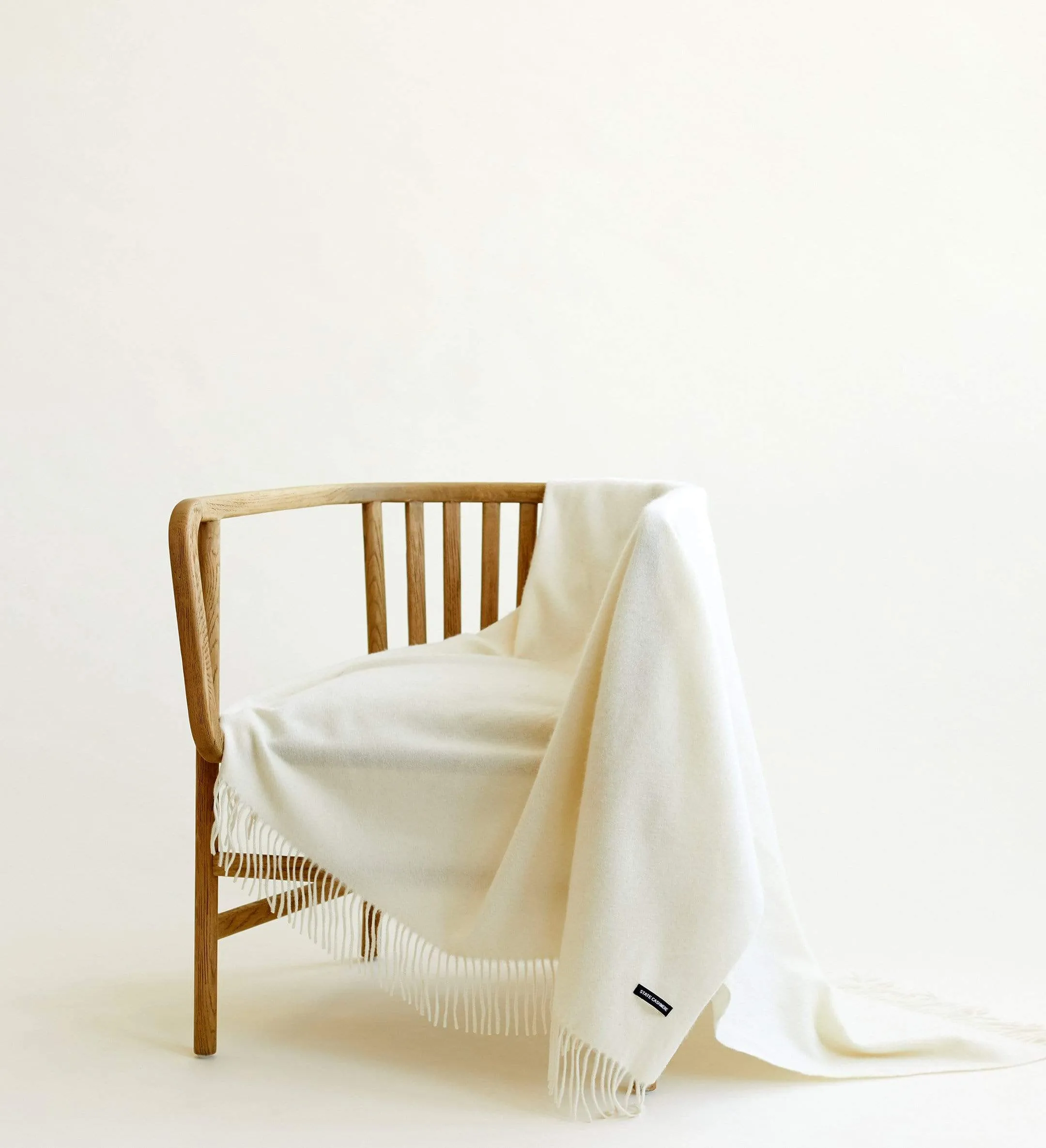 The Solid Cashmere Fringe Throw Blanket