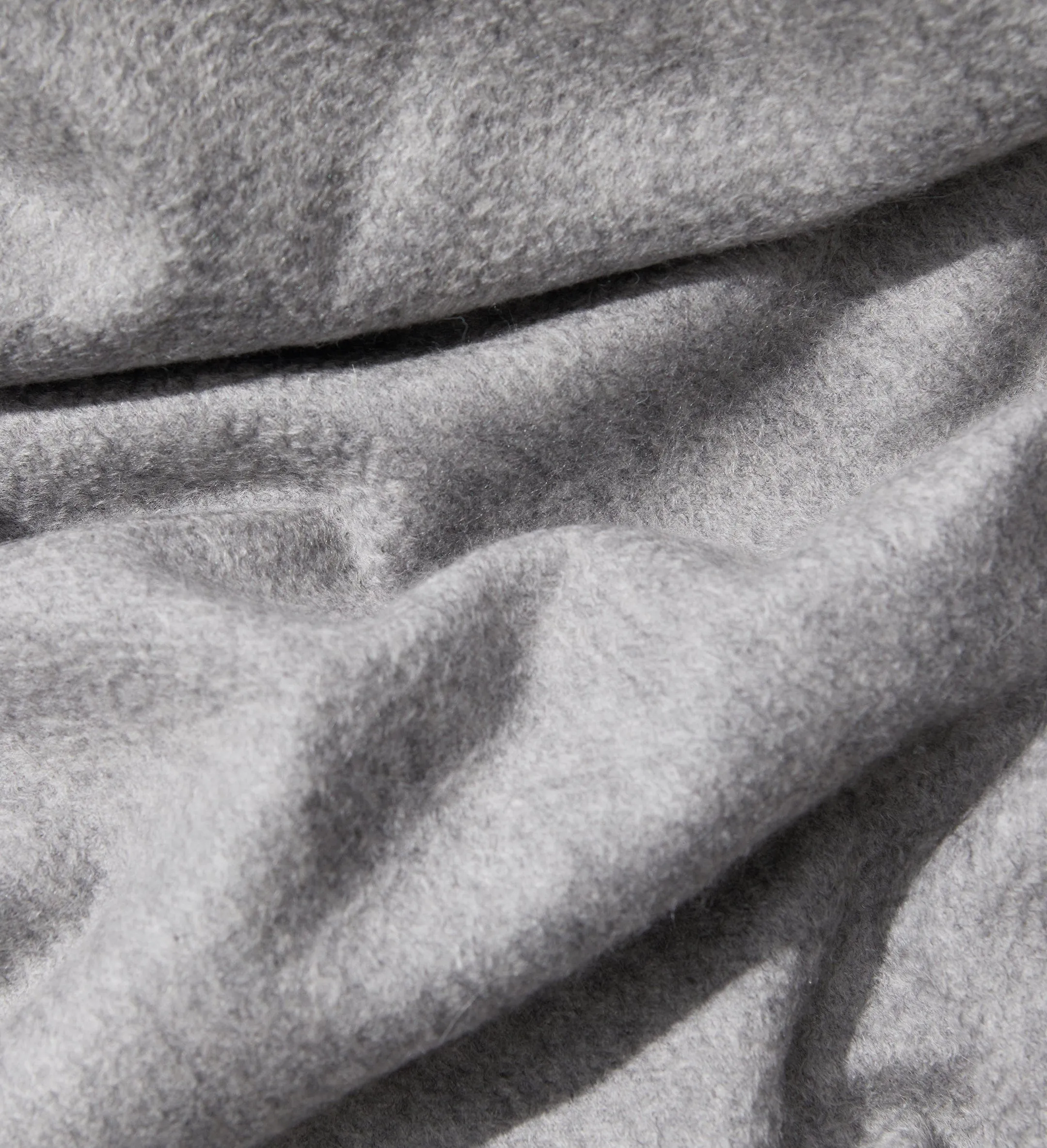 The Solid Cashmere Fringe Throw Blanket