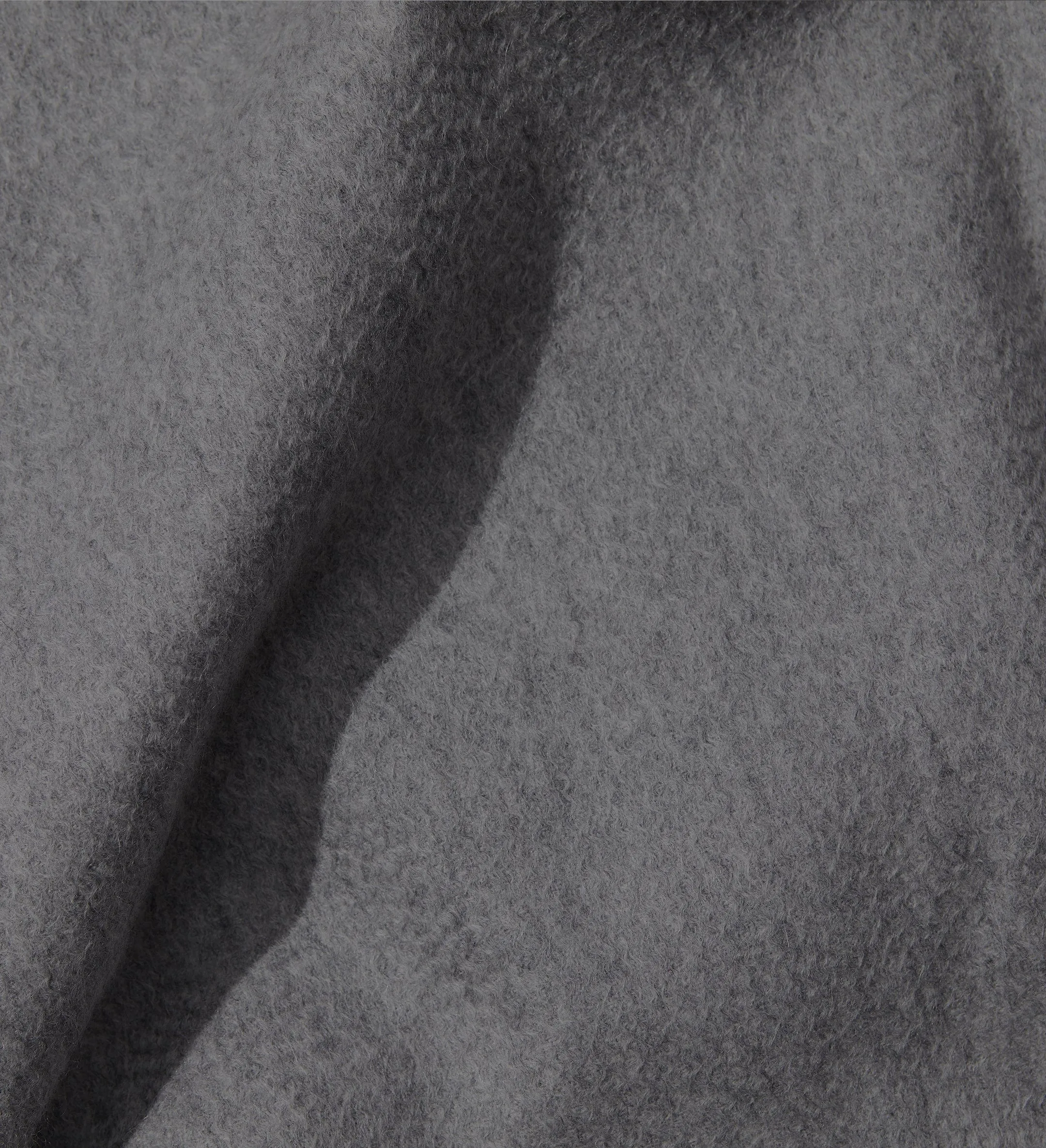 The Solid Cashmere Fringe Throw Blanket